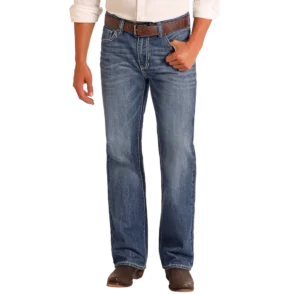 Man wearing the Double Barrel relaxed straight leg jeans in a medium vintage wash, representing classic western wear.