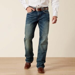 Men's Coltrane relaxed fit boot cut jeans in a classic denim wash, showcasing the western wear style.