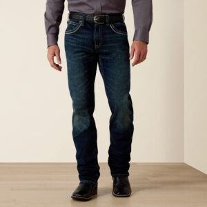 Man wearing the Coltrane slim straight mid-rise jeans, showcasing a modern western wear style.