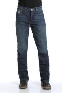 Man wearing the Cinch Silver Label slim straight jeans, showcasing the detailed dark stonewash and modern western wear fit.