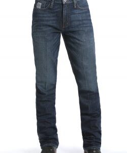 Man wearing the Cinch Silver Label slim straight jeans, showcasing the detailed dark stonewash and modern western wear fit.